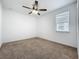 Bedroom featuring neutral carpet, a ceiling fan, fresh paint and a window at 12791 Westside Village Loop, Windermere, FL 34786