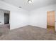 A carpeted bedroom featuring neutral walls and a door leading to a closet at 12791 Westside Village Loop, Windermere, FL 34786