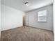 Bedroom features neutral carpet, fresh paint, closet and a window letting in natural light at 12791 Westside Village Loop, Windermere, FL 34786