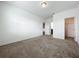 Carpeted bedroom with access to closet and bathroom at 12791 Westside Village Loop, Windermere, FL 34786