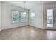 Dining area bathed in natural light, enhanced by large windows and sliding glass door at 12791 Westside Village Loop, Windermere, FL 34786
