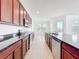 Well-appointed kitchen showcasing granite countertops, ample cabinetry, and stainless appliances at 12791 Westside Village Loop, Windermere, FL 34786