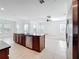 Open kitchen featuring large island with sink and stainless-steel dishwasher at 12791 Westside Village Loop, Windermere, FL 34786