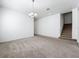 Open-concept living room with recessed lighting, seamlessly connecting the stairs to the right at 12791 Westside Village Loop, Windermere, FL 34786