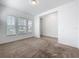 Bright living area features neutral carpeting, and multiple windows allowing for natural light at 12791 Westside Village Loop, Windermere, FL 34786