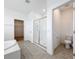 Ensuite bathroom with glass shower, toilet and linen closet at 12791 Westside Village Loop, Windermere, FL 34786