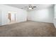 Spacious main bedroom with neutral carpet and ensuite bath that has a large walk-in closet at 12791 Westside Village Loop, Windermere, FL 34786