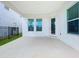 Covered patio with a view of the fenced backyard and white exterior walls at 12791 Westside Village Loop, Windermere, FL 34786