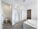 Bathroom features a walk-in shower, toilet, and door to the walk-in closet at 12880 Westside Village Loop, Windermere, FL 34786