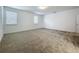 Bedroom with carpet flooring and white walls with large windows for natural light at 12880 Westside Village Loop, Windermere, FL 34786