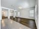 Open floor plan with hardwood floors and tiled floors and white walls that flow through the living spaces at 12880 Westside Village Loop, Windermere, FL 34786
