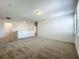 Upstairs loft features neutral carpet, white walls, a ceiling light and a view into the hallway and bathroom at 12880 Westside Village Loop, Windermere, FL 34786