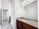 Bright bathroom features granite counters, modern vanity and sink, and neutral tile floors at 12971 Westside Village Loop, Windermere, FL 34786