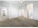 Bright bedroom features neutral carpet, multiple doors leading to a walk-in closet and other rooms at 12971 Westside Village Loop, Windermere, FL 34786