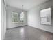 Bright, empty bedroom with tile floors and large windows providing lots of light at 12971 Westside Village Loop, Windermere, FL 34786
