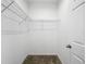 A white walk-in closet with metal shelving at 12971 Westside Village Loop, Windermere, FL 34786