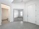 Open foyer with tile flooring leading to bathroom and office space at 12971 Westside Village Loop, Windermere, FL 34786