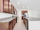 Modern kitchen featuring stainless steel appliances and granite countertops at 12971 Westside Village Loop, Windermere, FL 34786