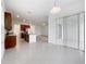 Modern kitchen featuring stainless steel appliances, a tile floor, and granite countertops at 12971 Westside Village Loop, Windermere, FL 34786