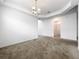 Bright living room featuring carpeted floors, white walls, and ample natural light at 12971 Westside Village Loop, Windermere, FL 34786