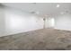 A bright living room featuring neutral carpeting and a large open floor plan at 12971 Westside Village Loop, Windermere, FL 34786