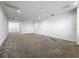 A bright living room featuring neutral carpeting and a large open floor plan at 12971 Westside Village Loop, Windermere, FL 34786