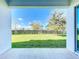 Covered patio with view of backyard and neighborhood at 12971 Westside Village Loop, Windermere, FL 34786