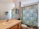 Bathroom with a vanity, large mirror, and a shower featuring a decorative curtain at 131 Stella Pass, Davenport, FL 33837