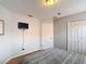 Upstairs bedroom with neutral paint, carpet flooring, and closet at 131 Stella Pass, Davenport, FL 33837
