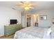 Bedroom showcases a large green dresser, bed, and multiple doorways at 131 Stella Pass, Davenport, FL 33837