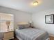 Guest bedroom featuring a full bed, window view, and coastal inspired decor at 131 Stella Pass, Davenport, FL 33837