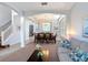 Elegant dining room with a large table, archways, recessed shelving, and natural light at 131 Stella Pass, Davenport, FL 33837