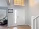 Bright foyer features tile flooring, high ceilings and a large front door with sidelights, leading into the home at 131 Stella Pass, Davenport, FL 33837