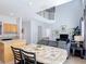Open floor plan featuring a view to the kitchen and the adjacent living room at 131 Stella Pass, Davenport, FL 33837