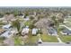 Aerial view of the property showcasing its location within a mature and verdant neighborhood at 1518 Ohio Ave, St Cloud, FL 34769
