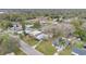 Community aerial view of the property in a quiet neighborhood with mature trees at 1518 Ohio Ave, St Cloud, FL 34769