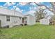 Backyard with a shed for storage and a green lawn at 1518 Ohio Ave, St Cloud, FL 34769