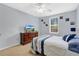 Comfortable bedroom with neutral tones, natural light, and an attached bath at 1518 Ohio Ave, St Cloud, FL 34769