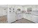 Well-lit kitchen featuring white appliances and ample counter space at 1518 Ohio Ave, St Cloud, FL 34769
