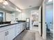 Modern bathroom features double sinks, black countertops, and stylish vanity at 16150 Parkwyn St, Winter Garden, FL 34787