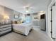 Comfortable bedroom with neutral tones, ceiling fan, and ample natural light at 16150 Parkwyn St, Winter Garden, FL 34787