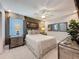 Tastefully decorated bedroom with stylish furnishings, ceiling fan, and warm ambiance at 16150 Parkwyn St, Winter Garden, FL 34787