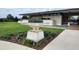 Clubhouse entrance featuring stone planters and manicured landscaping at 16150 Parkwyn St, Winter Garden, FL 34787
