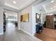 Inviting foyer with tile flooring, leading to the open-concept living spaces and a decorative accent wall at 16150 Parkwyn St, Winter Garden, FL 34787