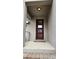 Inviting front door with glass inserts, a modern design, and a covered porch providing shelter and style at 16150 Parkwyn St, Winter Garden, FL 34787
