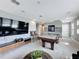 Game room featuring a pool table, TV, and comfortable seating at 16150 Parkwyn St, Winter Garden, FL 34787