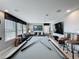 Game room featuring a pool table, tv, seating and window blinds at 16150 Parkwyn St, Winter Garden, FL 34787
