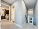Hallway leading to a bedroom, featuring soft carpet and light gray walls at 16150 Parkwyn St, Winter Garden, FL 34787
