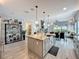 Open kitchen features a large island with seating, perfect for gathering and entertaining at 16150 Parkwyn St, Winter Garden, FL 34787