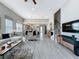 Spacious open-concept living room with tile flooring flowing into the kitchen and entryway at 16150 Parkwyn St, Winter Garden, FL 34787